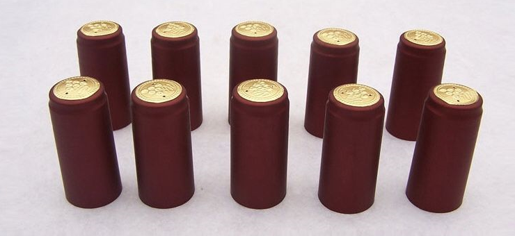 Burgundy PVC shrink capsules with gold top