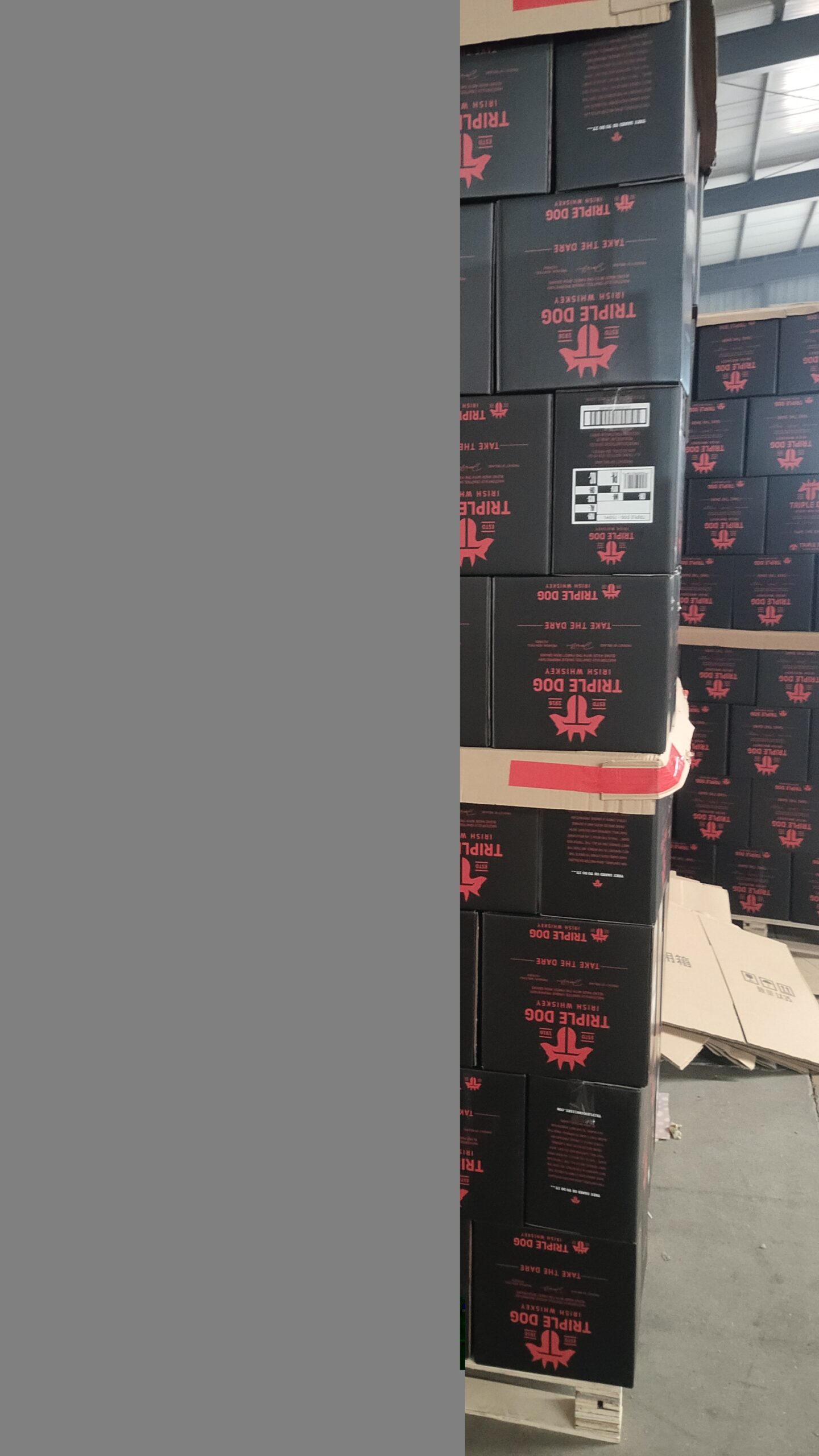 Warehouse of export cartons stacked on pallets with customer labels
