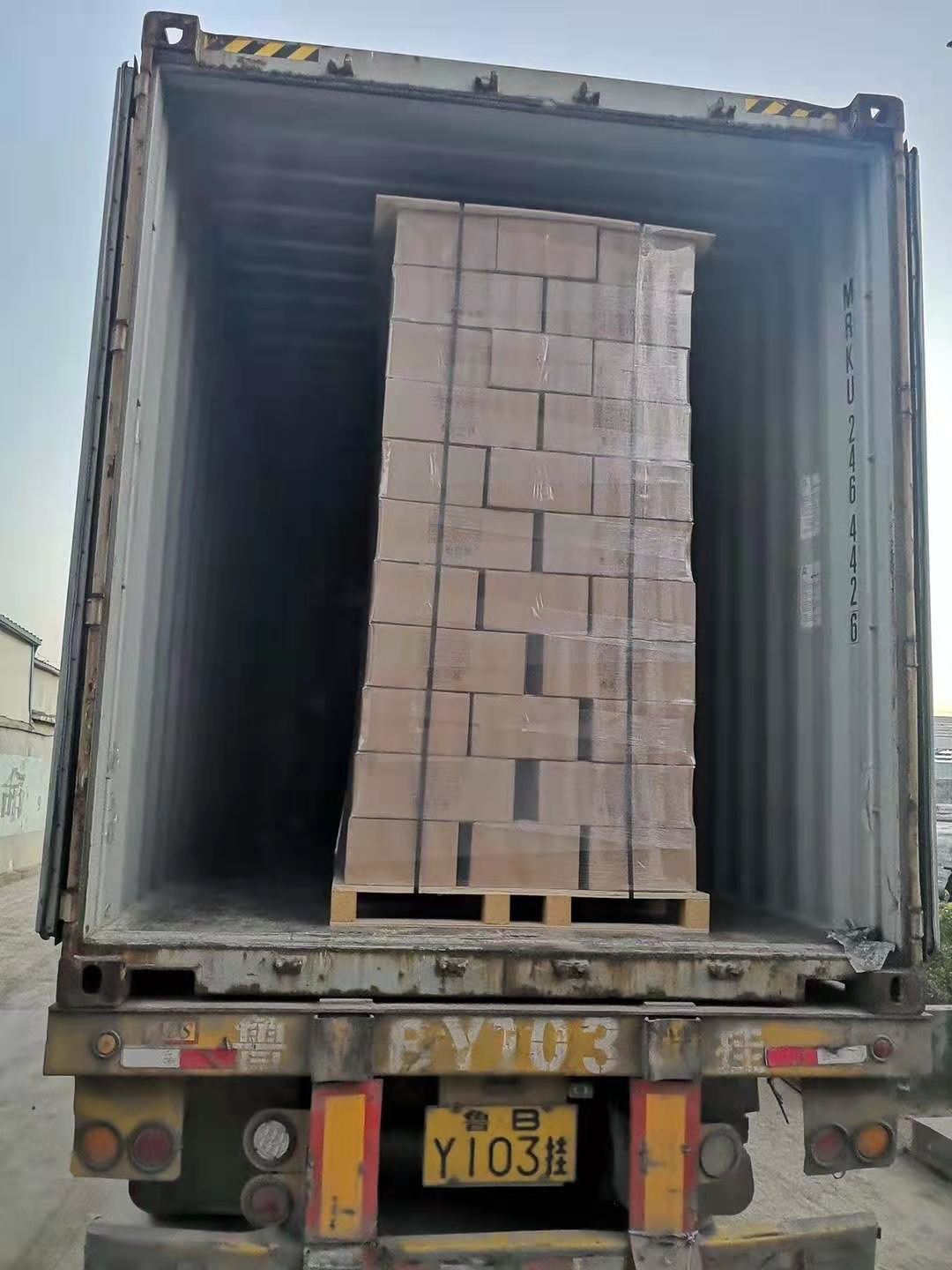 Pallet of bottle cartons loaded and secured inside the truck / container