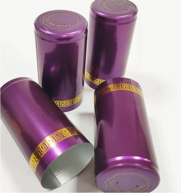 Purple aluminum capsules with gold print