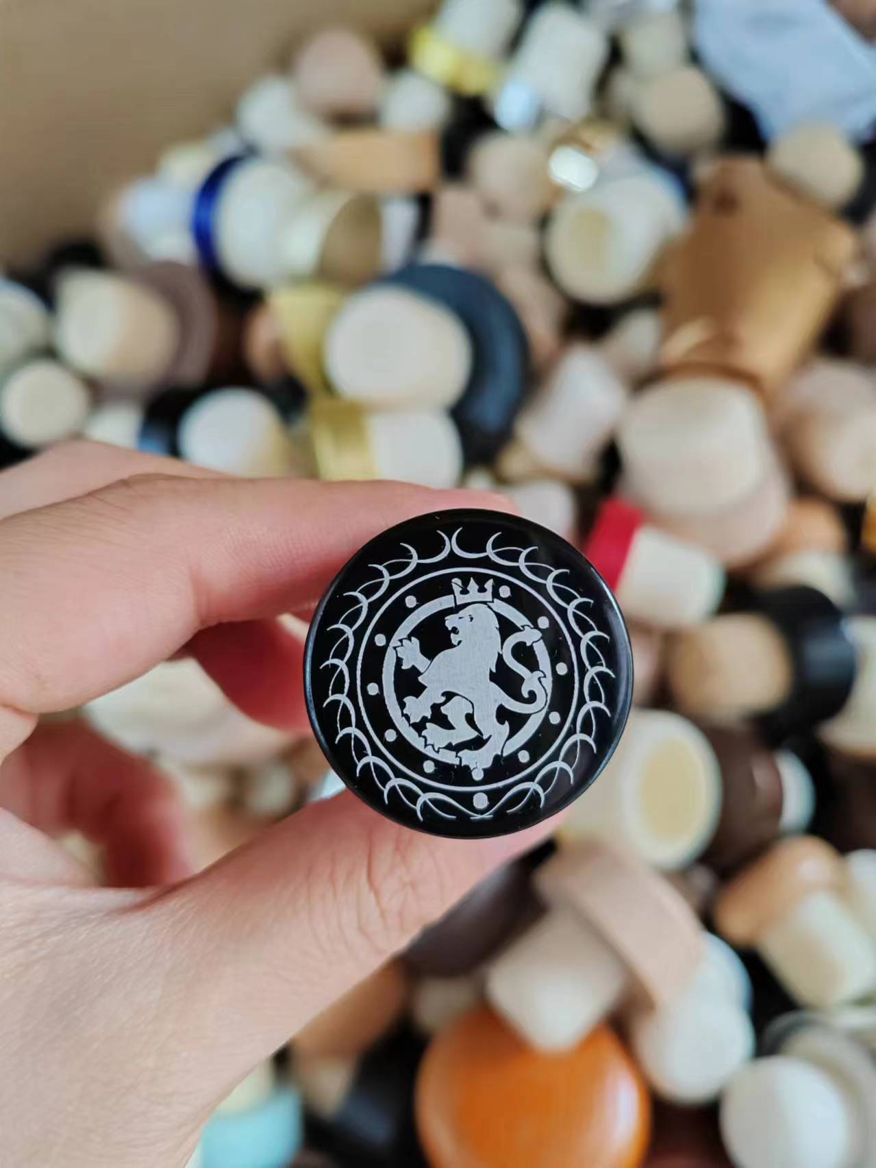 Black painted wooden cap with white engraved lion crest logo