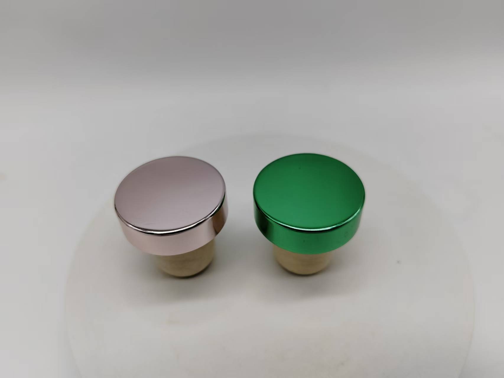 Rose Pink And Green Aluminum T-Caps On Cork Base